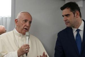 Pope Francis and Vatican spokesman Alessandro Gisotti aboard the papal plane Jan. 28.
Pope Francis and Vatican spokesman Alessandro Gisotti aboard the papal plane Jan. 28.