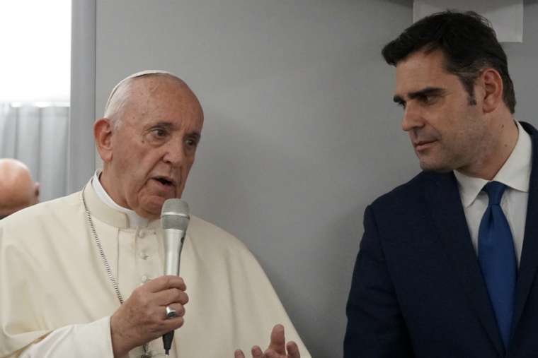 Pope Francis and Vatican spokesman Alessandro Gisotti aboard the papal plane Jan. 28.
Pope Francis and Vatican spokesman Alessandro Gisotti aboard the papal plane Jan. 28.