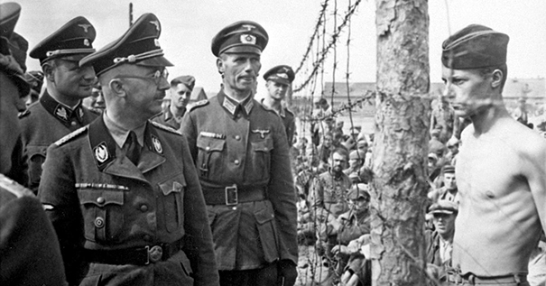 An unnamed prisoner of war confronts Heinrich Himmler at Shirokaya Street POW Camp in Minsk, USSR, August 1941. An unnamed prisoner of war confronts Heinrich Himmler at Shirokaya Street POW Camp in Minsk, USSR, August 1941.