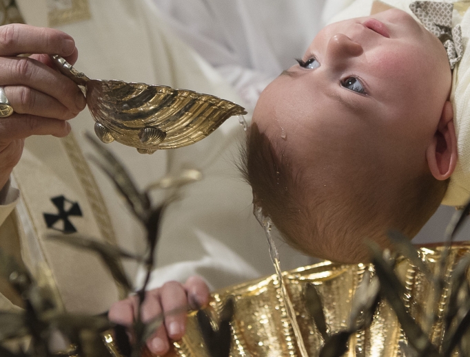 Pope Francis baptizes an infant in the Sistine Chapel on the feast of the Baptism of the Lord on Jan. 10, 2016. Pope Francis baptizes an infant in the Sistine Chapel on the feast of the Baptism of the Lord on Jan. 10, 2016.