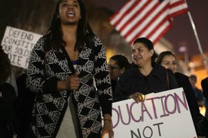 Demonstrators hold a vigil in support of immigrant children fleeing violence in Central America outside the White House on Nov. 24. Demonstrators hold a vigil in support of immigrant children fleeing violence in Central America outside the White House on Nov. 24.