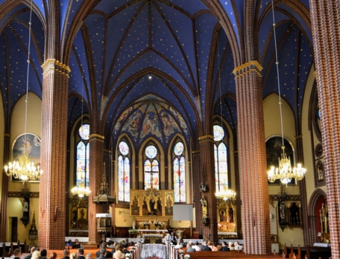 The faithful praying inside a Catholic church in Poland. The faithful praying inside a Catholic church in Poland.