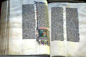 A Bible handwritten in Latin, on display in Malmesbury Abbey, Wiltshire, England. The Bible was written in Belgium in 1407, for reading aloud in a monastery.
A Bible handwritten in Latin, on display in Malmesbury Abbey, Wiltshire, England. The Bible was written in Belgium in 1407, for reading aloud in a monastery.