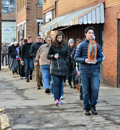 A group of students from Franciscan University of Steubenville lead a Rosary walk through the streets of Steubenville, Ohio. A group of students from Franciscan University of Steubenville lead a Rosary walk through the streets of Steubenville, Ohio.