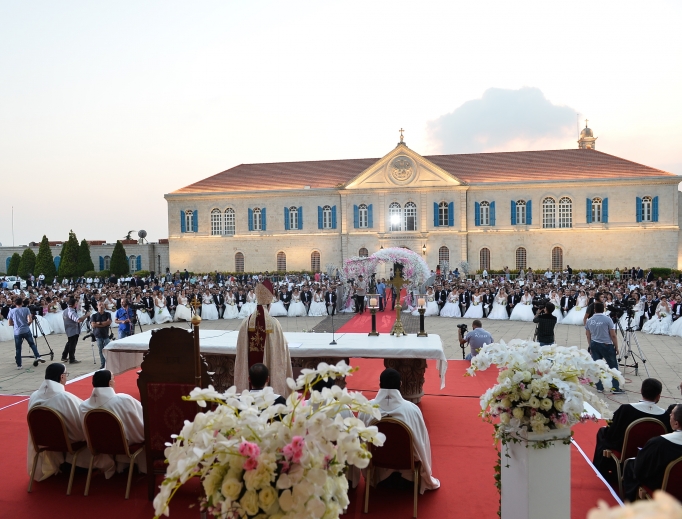Lebanese Cardinal Bechara Rai, patriarch of Maronite Catholics, celebrates a wedding Mass for 41 couples Sept. 2 at Berke, the Maronite patriarchate north of Beirut. Since the first collective wedding in 2009, a total of 240 couples have been married. Lebanese Cardinal Bechara Rai, patriarch of Maronite Catholics, celebrates a wedding Mass for 41 couples Sept. 2 at Berke, the Maronite patriarchate north of Beirut. Since the first collective wedding in 2009, a total of 240 couples have been married.