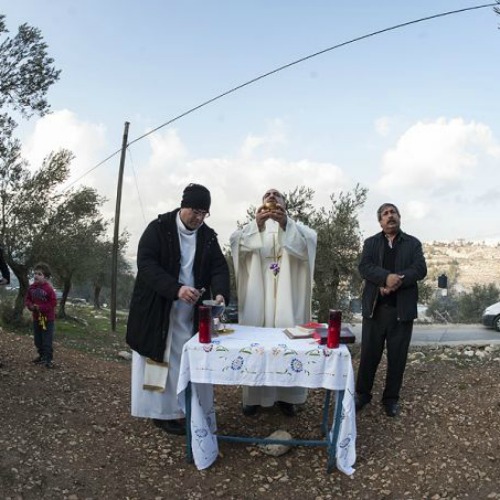 Mass being celebrated at the proposed site of an Israeli security wall in the West Bank's Cremisan Valley on Jan. 17, 2014.
Mass being celebrated at the proposed site of an Israeli security wall in the West Bank's Cremisan Valley on Jan. 17, 2014.