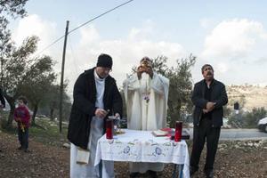 Mass being celebrated at the proposed site of an Israeli security wall in the West Bank's Cremisan Valley on Jan. 17, 2014.
Mass being celebrated at the proposed site of an Israeli security wall in the West Bank's Cremisan Valley on Jan. 17, 2014.
