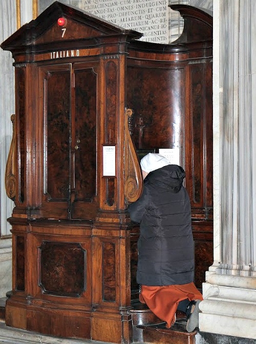 A priest hears a woman's confession at the Vigil for Life at the Basilica of St. Mary Major in March. A priest hears a woman's confession at the Vigil for Life at the Basilica of St. Mary Major in March.