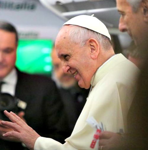 Pope Francis speaks with reporters aboard the papal plane.
Pope Francis speaks with reporters aboard the papal plane.