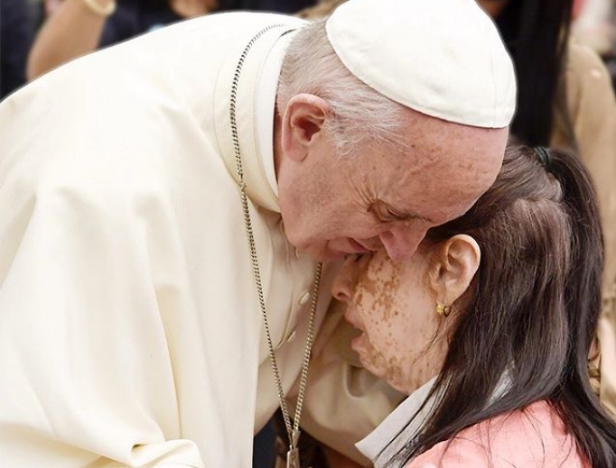 Francis gives a hug May 18. Francis gives a hug May 18.