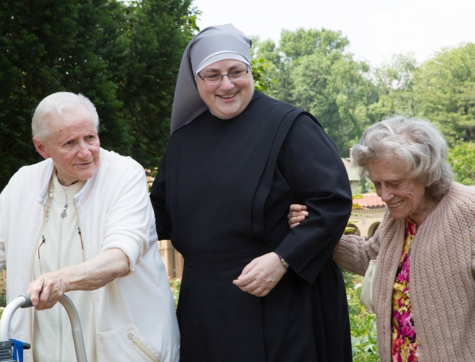 Sister Constance Veit (shown above) and other sisters interact with their dear residents in happier times; the Little Sisters of the Poor continue to provide care and fellowship according to mandated guidelines in this time of coronavirus pandemic. Sister Constance Veit (shown above) and other sisters interact with their dear residents in happier times; the Little Sisters of the Poor continue to provide care and fellowship according to mandated guidelines in this time of coronavirus pandemic.