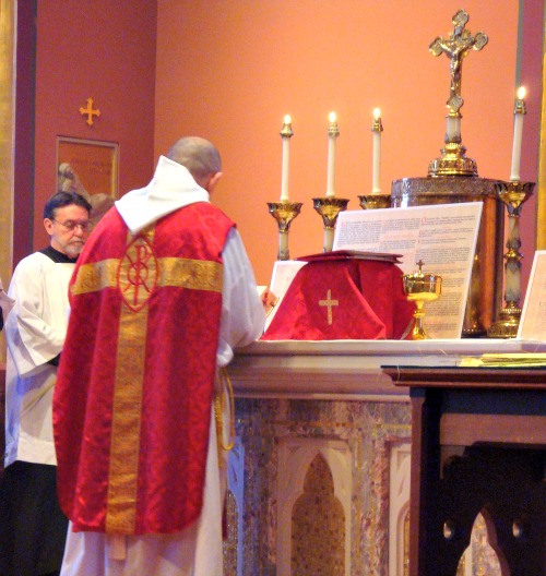 A priest faces 'ad orientem' during Mass in the chapel of the Cathedral of the Holy Cross in Boston. A priest faces 'ad orientem' during Mass in the chapel of the Cathedral of the Holy Cross in Boston.