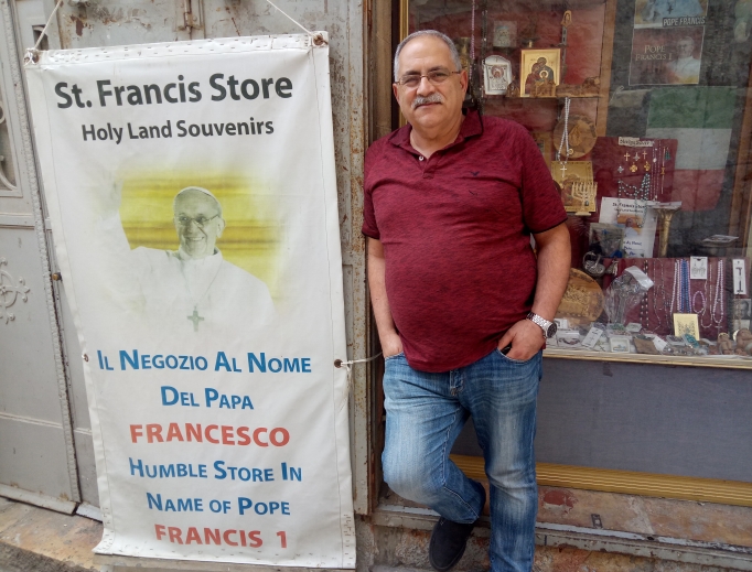 Above, Alfred Ra’ad, the Catholic owner of the St. Francis Store in the Christian Quarter of the Old City of Jerusalem, used to earn $300-$400 per day before the Jerusalem municipality built a light rail line right outside the entrance to the Christian Quarter. Today, tour buses cannot park there, and Ra’ad sometimes earns as little as $10 per day. Below, schoolchildren walk through the Christian Quarter of the Old City of Jerusalem, where the population is about 20% Christian and 80% Muslim. The number of Christians in the Holy Land, now less than 2% of the population, continues to dwindle. Above, Alfred Ra’ad, the Catholic owner of the St. Francis Store in the Christian Quarter of the Old City of Jerusalem, used to earn $300-$400 per day before the Jerusalem municipality built a light rail line right outside the entrance to the Christian Quarter. Today, tour buses cannot park there, and Ra’ad sometimes earns as little as $10 per day. Below, schoolchildren walk through the Christian Quarter of the Old City of Jerusalem, where the population is about 20% Christian and 80% Muslim. The number of Christians in the Holy Land, now less than 2% of the population, continues to dwindle.