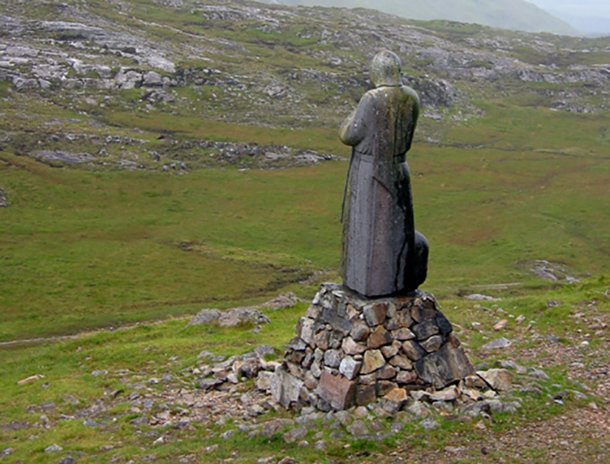 A statue of St. Patrick watches over Mam Ean pass. The mountain in the background is Binn Mhor. A statue of St. Patrick watches over Mam Ean pass. The mountain in the background is Binn Mhor.