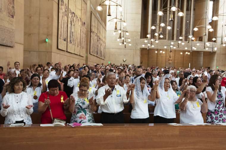 Faithful pray at the Sept. 7 Mass in recognition of all immigrants at the Cathedral of Our Lady of the Angels in Los Angeles. Faithful pray at the Sept. 7 Mass in recognition of all immigrants at the Cathedral of Our Lady of the Angels in Los Angeles.