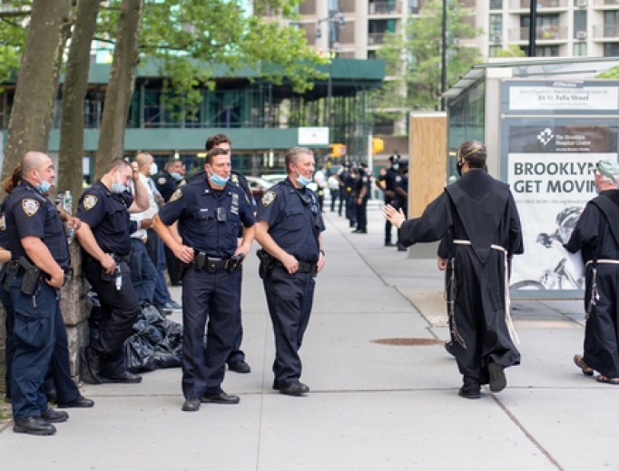 Priests pass a group of NYPD officers during a Black Lives Matter protest in Manhattan on June 4, 2020. Priests pass a group of NYPD officers during a Black Lives Matter protest in Manhattan on June 4, 2020.