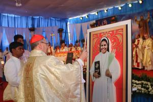 Above, Cardinal Angelo Amato blesses a portrait of Blessed Rani Maria Vattalil Nov. 4. Below, Cardinal Telesphore Toppo greets Sister Rani's killer, Samandar Singh. Above, Cardinal Angelo Amato blesses a portrait of Blessed Rani Maria Vattalil Nov. 4. Below, Cardinal Telesphore Toppo greets Sister Rani's killer, Samandar Singh.