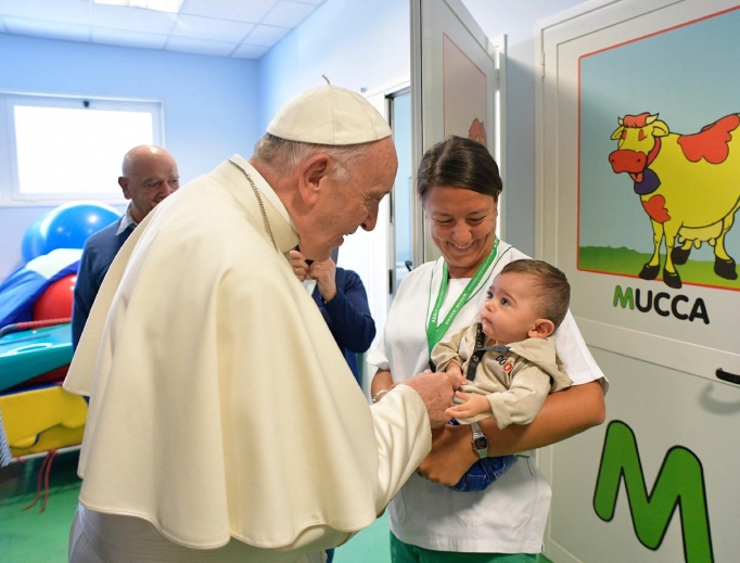 Pope Francis visits a little patient at the Santa Lucia Foundation neuro-rehabilitation center in Rome Sept. 22. Pope Francis visits a little patient at the Santa Lucia Foundation neuro-rehabilitation center in Rome Sept. 22.