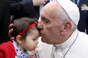 Pope Francis kisses a child in Fatima, Portugal, May 12 in preparation for the 100th anniversary of the Fatima apparitions and the canonization of Francisco and Jacinta Marto.
Pope Francis kisses a child in Fatima, Portugal, May 12 in preparation for the 100th anniversary of the Fatima apparitions and the canonization of Francisco and Jacinta Marto.