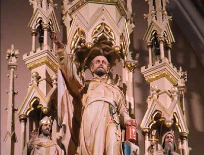 The 19th-century church, from the Gothic altar (below) with a St. Ignatius statue (above) to the colorful windows, reflects commitment to the faith and missionary heritage. The 19th-century church, from the Gothic altar (below) with a St. Ignatius statue (above) to the colorful windows, reflects commitment to the faith and missionary heritage.