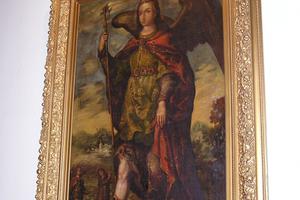 In the cathedral entrance hangs a large painting of the cathedral’s patron, St. Raphael the Archangel. The wood decor and statues create a prayerful atmosphere in the oldest parish in Iowa In the cathedral entrance hangs a large painting of the cathedral’s patron, St. Raphael the Archangel. The wood decor and statues create a prayerful atmosphere in the oldest parish in Iowa