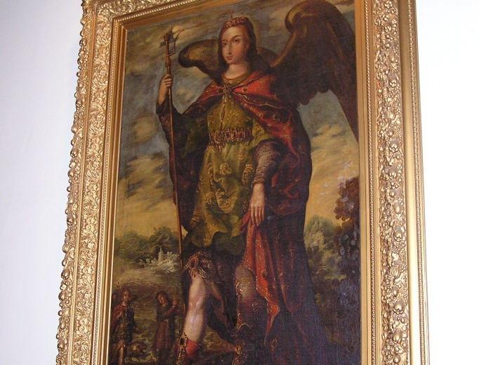 In the cathedral entrance hangs a large painting of the cathedral’s patron, St. Raphael the Archangel. The wood decor and statues create a prayerful atmosphere in the oldest parish in Iowa In the cathedral entrance hangs a large painting of the cathedral’s patron, St. Raphael the Archangel. The wood decor and statues create a prayerful atmosphere in the oldest parish in Iowa