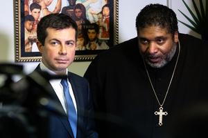 Democratic presidential candidate Pete Buttigieg (l) and Rev. William Barber talk to the press after a Sunday morning service Dec. 1, 2019, at Greenleaf Christian Church in Goldsboro, North Carolina.
Democratic presidential candidate Pete Buttigieg (l) and Rev. William Barber talk to the press after a Sunday morning service Dec. 1, 2019, at Greenleaf Christian Church in Goldsboro, North Carolina.