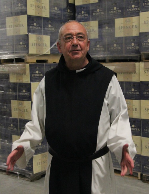 Spencer Brewery director Father Isaac stands in front of cases of Spencer Trappist Ale, the first certified Trappist beer made outside of Europe. Spencer Brewery director Father Isaac stands in front of cases of Spencer Trappist Ale, the first certified Trappist beer made outside of Europe.