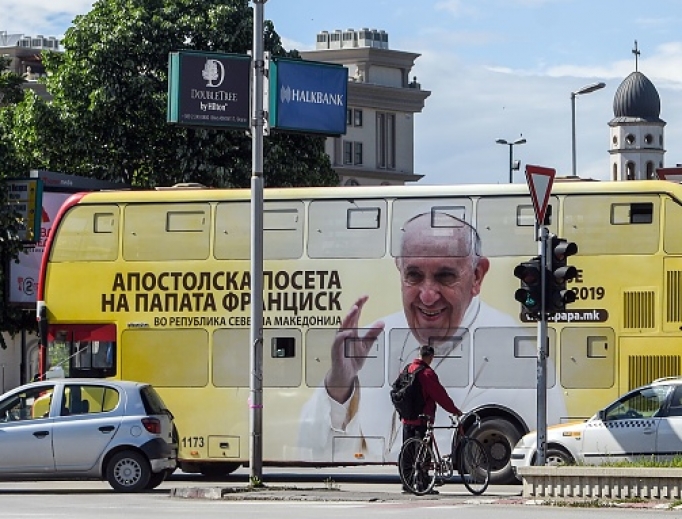 A bus featuring the portrait of Pope Francis drives in Skopje on May 6, ahead of the papal visit. Pope Francis three-day tour, in Bulgaria and in North Macedonia, includes a commemoration of Mother Teresa, the most famous native of the North Macedonia's capital of Skopje.
A bus featuring the portrait of Pope Francis drives in Skopje on May 6, ahead of the papal visit. Pope Francis three-day tour, in Bulgaria and in North Macedonia, includes a commemoration of Mother Teresa, the most famous native of the North Macedonia's capital of Skopje.