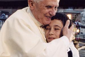 Pope Benedict XVI hugs a boy during his weekly General Audience. Pope Benedict XVI hugs a boy during his weekly General Audience.