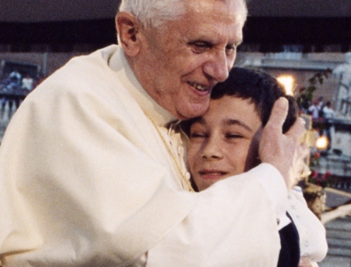 Pope Benedict XVI hugs a boy during his weekly General Audience. Pope Benedict XVI hugs a boy during his weekly General Audience.