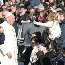 Pope Francis greets a family of pilgrims in St. Peter's Square on Dec. 4, 2013.
Pope Francis greets a family of pilgrims in St. Peter's Square on Dec. 4, 2013.