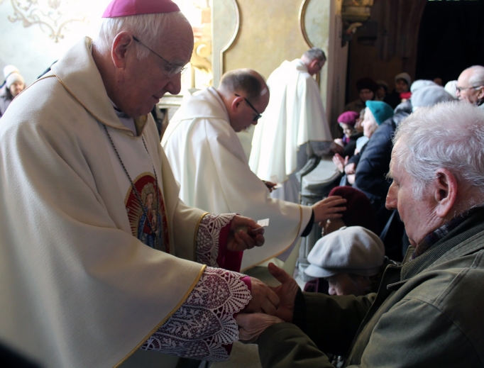 Bishop Ignacy Dec of Swidnica, Poland, anoints the sick of his diocese at a service last month. Bishop Ignacy Dec of Swidnica, Poland, anoints the sick of his diocese at a service last month.