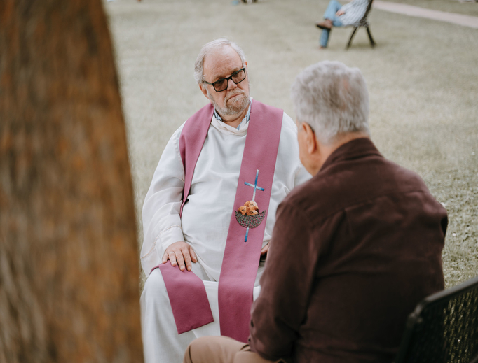 Father Giancarlo Ghezzi, associate pastor of St. Mary of the Immaculate Conception Parish in Monroe, hears a man's confession during the Monroe Vicariate's “Priests in the Park” event June 17. Father Giancarlo Ghezzi, associate pastor of St. Mary of the Immaculate Conception Parish in Monroe, hears a man's confession during the Monroe Vicariate's “Priests in the Park” event June 17.