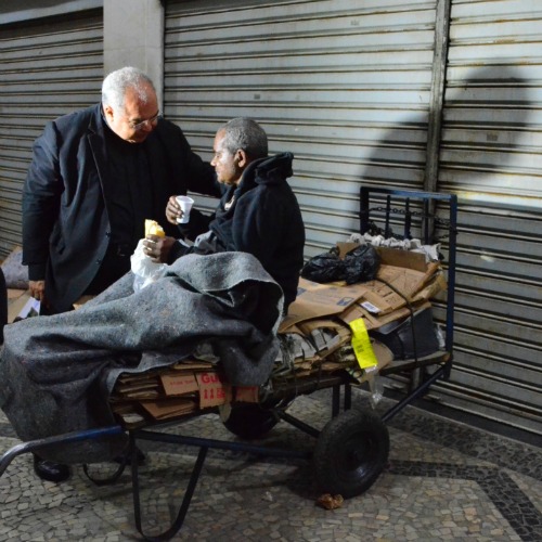 Cardinal Tempesta meets with a homeless man on the streets of Rio. Cardinal Tempesta meets with a homeless man on the streets of Rio.