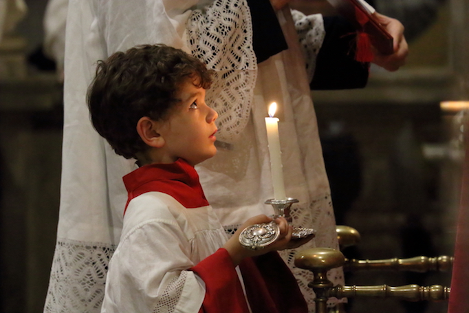 An altar boy at Solemn Vespers on the Feast of the Exultation of the Holy Cross, St Mark's basilica, on the occasion of the 10th anniversary of Summorum Pontificum, Rome, Sept. 15, 2017. Photos from top to bottom: Solemn High Mass in St. Peter’s basilica, Solemn High Mass at the basilica of Santa Maria Sopra Minerva, priests process through Rome, Archbishop Guido Pozzo, priests process towards St. Peter’s basilica, lay faithful and clergy process through Rome, Msgr. Gilles Wach celebrates Mass in Santa Maria Sopra Minivera, Father Claude Barth at Solemn Vespers, Martin Mosebach, Archbishop Pozzo at the beginning of Mass in St. Peter’s, Cardinal Robert Sarah, Cardinal Gerhard Müller, Dominican nuns process over the Bridge of Angels, Solemn High Mass in Santa Maria Sopra Minerva. An altar boy at Solemn Vespers on the Feast of the Exultation of the Holy Cross, St Mark's basilica, on the occasion of the 10th anniversary of Summorum Pontificum, Rome, Sept. 15, 2017. Photos from top to bottom: Solemn High Mass in St. Peter’s basilica, Solemn High Mass at the basilica of Santa Maria Sopra Minerva, priests process through Rome, Archbishop Guido Pozzo, priests process towards St. Peter’s basilica, lay faithful and clergy process through Rome, Msgr. Gilles Wach celebrates Mass in Santa Maria Sopra Minivera, Father Claude Barth at Solemn Vespers, Martin Mosebach, Archbishop Pozzo at the beginning of Mass in St. Peter’s, Cardinal Robert Sarah, Cardinal Gerhard Müller, Dominican nuns process over the Bridge of Angels, Solemn High Mass in Santa Maria Sopra Minerva.