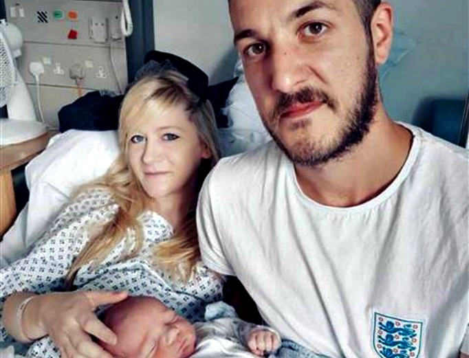 Chris Gard and Connie Yates hold their son. Chris Gard and Connie Yates hold their son.