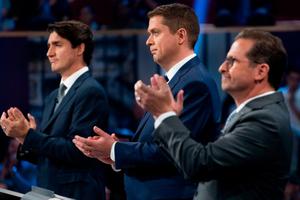 Canadian Prime Minister and Liberal leader Justin Trudeau (l), Conservative leader Andrew Scheer (c) and Bloc Quebecois leader Yves-Francois Blanchet applaud as they take part in the federal leaders French-language debate at the Canadian Museum of History in Gatineau, Quebec, on Oct. 10.
Canadian Prime Minister and Liberal leader Justin Trudeau (l), Conservative leader Andrew Scheer (c) and Bloc Quebecois leader Yves-Francois Blanchet applaud as they take part in the federal leaders French-language debate at the Canadian Museum of History in Gatineau, Quebec, on Oct. 10.