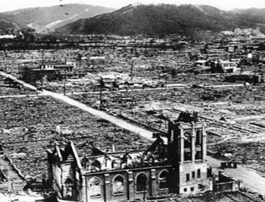 An aerial view of Our Lady of the Assumption Church after the Aug. 6, 1945, bombing. A small group of priests can be seen standing in the road in front of the church. An aerial view of Our Lady of the Assumption Church after the Aug. 6, 1945, bombing. A small group of priests can be seen standing in the road in front of the church.