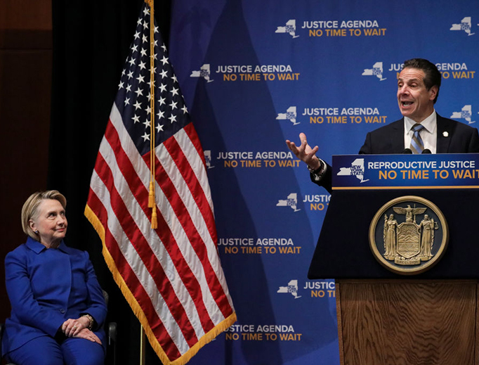 Former Secretary of State Hillary Clinton looks on as New York Governor Andrew Cuomo speaks about abortion at Barnard College, Jan. 7, 2019, in New York City. The two Democrats shared the stage to promote the Reproductive Health Act in New York.
Former Secretary of State Hillary Clinton looks on as New York Governor Andrew Cuomo speaks about abortion at Barnard College, Jan. 7, 2019, in New York City. The two Democrats shared the stage to promote the Reproductive Health Act in New York.