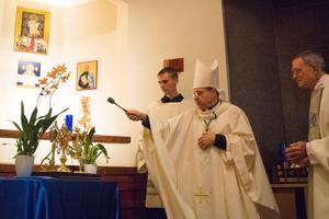 Above, Bishop Peter Uglietto, vicar general for the Archdiocese of Boston, blesses the relics at the Oct. 16 Mass. Below, the faithful pray at the Mass. Above, Bishop Peter Uglietto, vicar general for the Archdiocese of Boston, blesses the relics at the Oct. 16 Mass. Below, the faithful pray at the Mass.