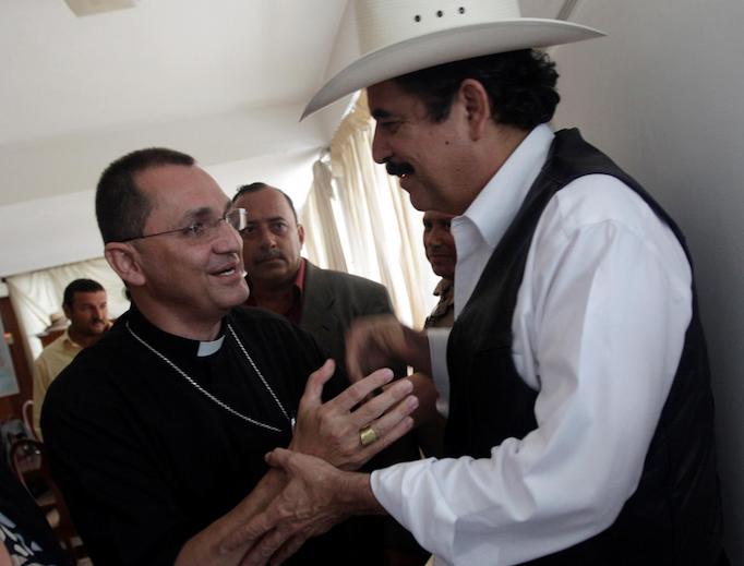 Auxiliary Bishop Juan José Pineda of Tegucigalpa shakes hands with Honduras' ousted President Manuel Zelaya (r) inside the Brazilian embassy in Tegucigalpa Sept. 24, 2009. Auxiliary Bishop Juan José Pineda of Tegucigalpa shakes hands with Honduras' ousted President Manuel Zelaya (r) inside the Brazilian embassy in Tegucigalpa Sept. 24, 2009.