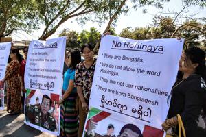 Ma Ba Tha Buddhists protest the use of the word 'Rohingya' as a Rakhine donation ship from Malaysia arrives Feb. 9 in Yangon, Burma. The Rohingya aid ship, Nautical Aliya, landed at Thilawa port near Yangon while making its way to the Rohingya refugee camps in Myanmar and Bangladesh, bearing 2,300 tons of food, clothes and medical supplies for the Rohingyas in the two countries. Below, Cardinal Charles Maung Bo of Myanmar has spoken with Pope Francis on alleviating the suffering of this Muslim minority. Ma Ba Tha Buddhists protest the use of the word 'Rohingya' as a Rakhine donation ship from Malaysia arrives Feb. 9 in Yangon, Burma. The Rohingya aid ship, Nautical Aliya, landed at Thilawa port near Yangon while making its way to the Rohingya refugee camps in Myanmar and Bangladesh, bearing 2,300 tons of food, clothes and medical supplies for the Rohingyas in the two countries. Below, Cardinal Charles Maung Bo of Myanmar has spoken with Pope Francis on alleviating the suffering of this Muslim minority.