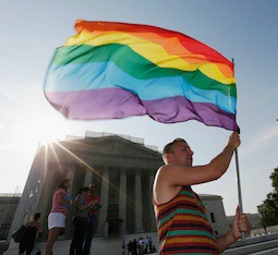 Homosexual activist celebrates June 26 outside the U.S. Supreme Court building in Washington. Homosexual activist celebrates June 26 outside the U.S. Supreme Court building in Washington.