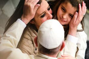 Pope Francis embraces a mother and child at the general audience in the Vatican's Paul VI Hall on Jan. 13.
Pope Francis embraces a mother and child at the general audience in the Vatican's Paul VI Hall on Jan. 13.