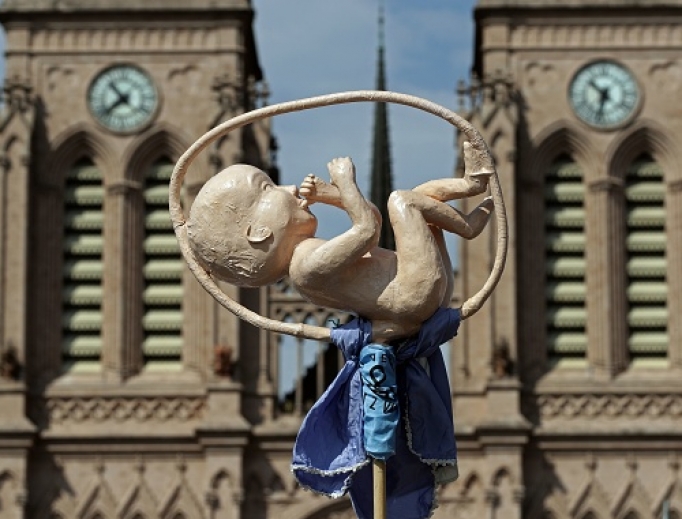 A model of a fetus is seen in front of the Basilica of the Virgin of Lujan, as the Argentine Catholic Church celebrates a March 8 Mass to pray for the rejection of the bill proposed by President Alberto Fernandez to decriminalizes abortion. A model of a fetus is seen in front of the Basilica of the Virgin of Lujan, as the Argentine Catholic Church celebrates a March 8 Mass to pray for the rejection of the bill proposed by President Alberto Fernandez to decriminalizes abortion.