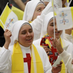 Nuns wave Vatican flags as they cheer prior to Pope Benedict XVI's general audience in Paul VI hall at the Vatican recently. Nuns wave Vatican flags as they cheer prior to Pope Benedict XVI's general audience in Paul VI hall at the Vatican recently.
