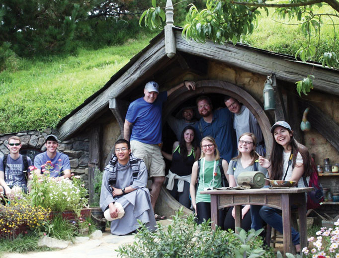 TOLKIEN TREK. Seton Hall pilgrims in front of the ‘hobbit hole’ in New Zealand. TOLKIEN TREK. Seton Hall pilgrims in front of the ‘hobbit hole’ in New Zealand.