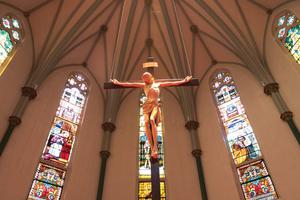 Above, the Crucified Christ above the new altar, while (below) the old altar highlights an elaborate Victorian Gothic style and an icon of the Holy Family and the current sanctuary draw the faithful to prayer. Above, the Crucified Christ above the new altar, while (below) the old altar highlights an elaborate Victorian Gothic style and an icon of the Holy Family and the current sanctuary draw the faithful to prayer.