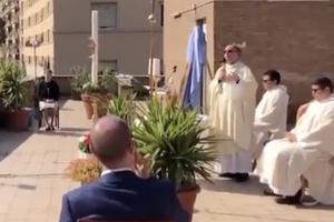 Fr. Carlo Purgatorio celebrates Mass on the rooftop in Rome. Fr. Carlo Purgatorio celebrates Mass on the rooftop in Rome.